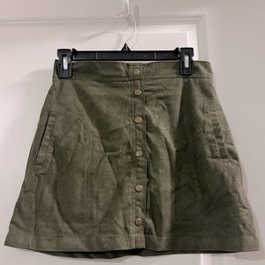 Army green suede mini skirt with bronze buttons and zipper. Size small